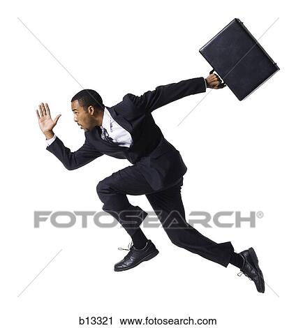 Businessman running with briefcase View Large Photo Image Stock Image - Businessman running with briefcase. Fotosearch