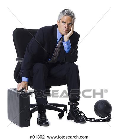 Businessman shackled to ball and chain View Large Photo Image Stock Image - Businessman shackled to ball and chain. Fotosearch