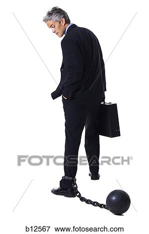Businessman shackled to ball and chain View Large Photo Image Stock Photo - Businessman shackled to ball and chain. Fotosearch