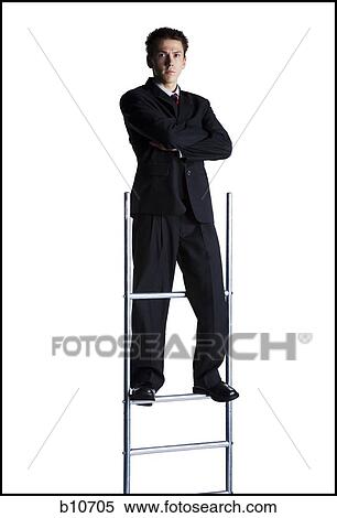 Businessman standing on corporate ladder View Large Photo Image Stock Photography - Businessman standing on corporate ladder. Fotosearch