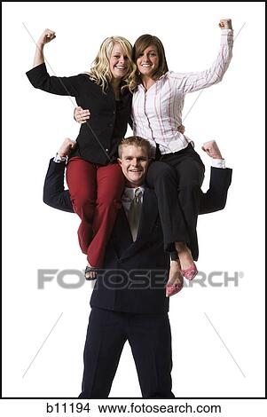 Businessman supporting colleagues on shoulders View Large Photo Image Picture - Businessman supporting colleagues on shoulders. Fotosearch