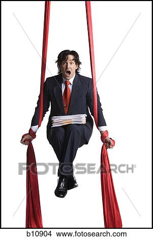 Businessman tangled in red drapes View Large Photo Image Picture - Businessman tangled in red drapes. Fotosearch