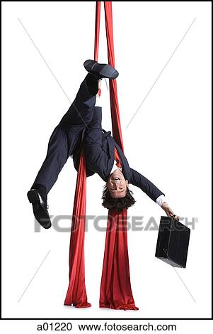 Businessman tangled in red drapes View Large Photo Image Stock Image - Businessman tangled in red drapes. Fotosearch