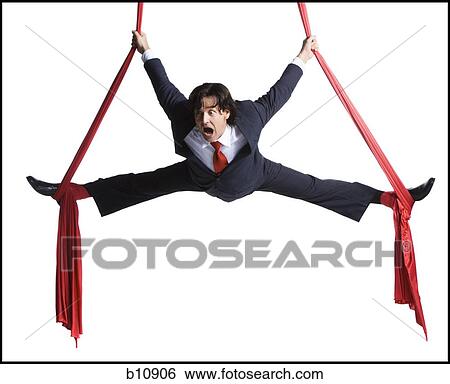 Stock Photograph - Businessman tangled in red drapes. Fotosearch