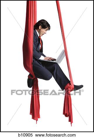 Businessman tangled in red drapes View Large Photo Image Stock Photography - Businessman tangled in red drapes. Fotosearch