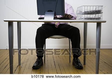 Stock Photo - Businessman using a computer. Fotosearch