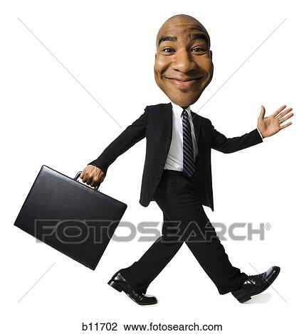 Stock Image - Businessman walking with briefcase. Fotosearch