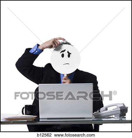 Businessman with confused face mask working on laptop View Large Photo Image Stock Image - Businessman with confused face mask working on laptop. Fotosearch