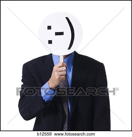 Businessman with sideways happy mask View Large Photo Image Stock Photo - Businessman with sideways happy mask. Fotosearch
