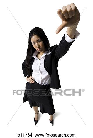 Picture - Businesswoman giving thumbs down signal. Fotosearch