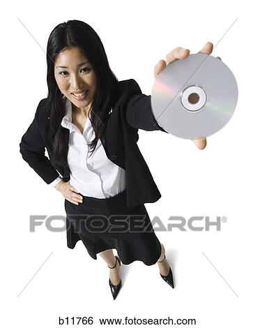 Businesswoman holding a CD View Large Photo Image Stock Photograph - Businesswoman holding a CD. Fotosearch