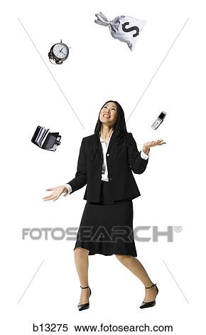 Businesswoman juggling View Large Photo Image Stock Photography - Businesswoman juggling. Fotosearch