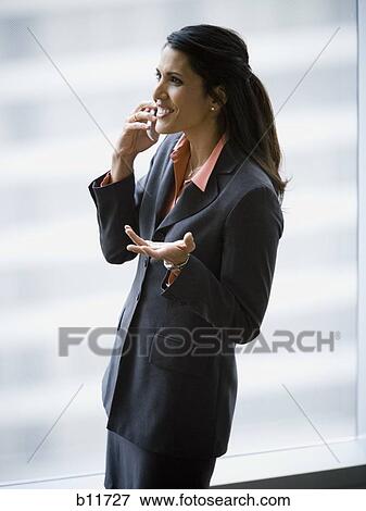 Businesswoman talking on cell phone View Large Photo Image Stock Photo - Businesswoman talking on cell phone. Fotosearch