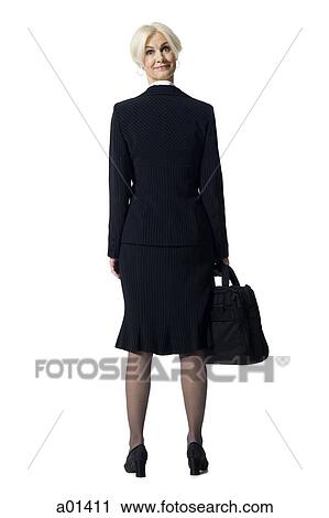 Businesswoman with briefcase and head backwards View Large Photo Image Stock Image - Businesswoman with briefcase and head backwards. Fotosearch