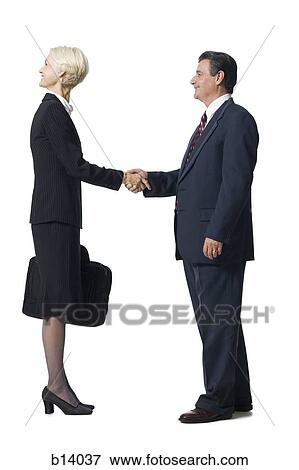 Businesswoman with head backwards shaking hands with businessman View Large Photo Image Stock Photo - Businesswoman with head backwards shaking hands with businessman. Fotosearch