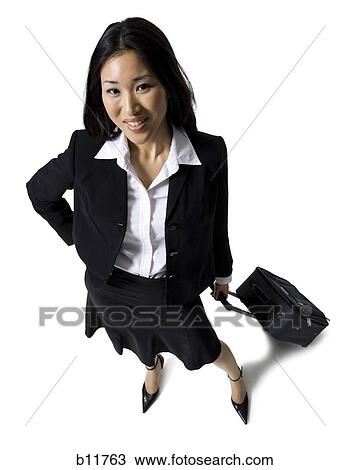 Stock Image - Businesswoman with luggage. Fotosearch