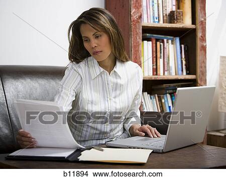Businesswoman working on laptop computer View Large Photo Image Picture - Businesswoman working on laptop computer. Fotosearch