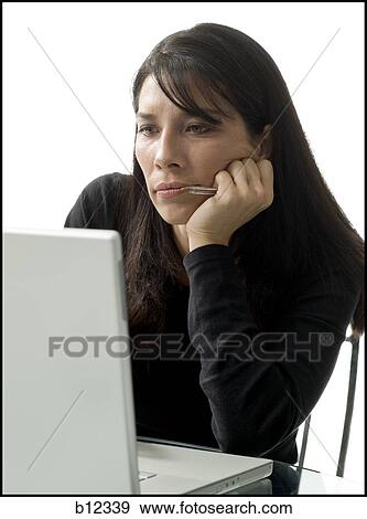 Businesswoman working on laptop computer View Large Photo Image Stock Photo - Businesswoman working on laptop computer. Fotosearch