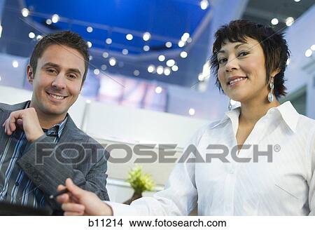 Casual male and female business acquaintances View Large Photo Image Picture - Casual male and female business acquaintances. Fotosearch