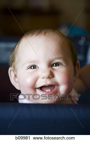 Close-up of a baby girl laughing View Large Photo Image Stock Image - Close-up of a baby girl laughing. Fotosearch