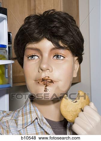 Close-up of a male mannequin holding a cookie View Large Photo Image Stock Photo - Close-up of a male mannequin holding a cookie. Fotosearch