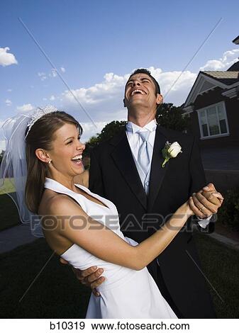 Stock Photo - Close-up of a newlywed couple dancing. Fotosearch