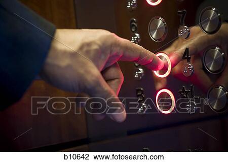 Close-up of a person's finger pressing a button of an elevator View Large Photo Image Stock Image - Close-up of a person's finger pressing a button of an elevator. Fotosearch