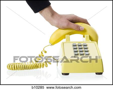Close-up of a person's hand picking up a banana telephone receiver View Large Photo Image Stock Photography - Close-up of a person's hand picking up a banana telephone receiver. Fotosearch