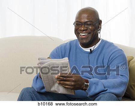 Close-up of a senior man reading a newspaper View Large Photo Image Stock Photo - Close-up of a senior man reading a newspaper. Fotosearch