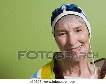 Close-up of a senior woman wearing a swimming cap and swimming goggles View Large Photo Image Stock Photo - Close-up of a senior woman wearing a swimming cap and swimming goggles. Fotosearch
