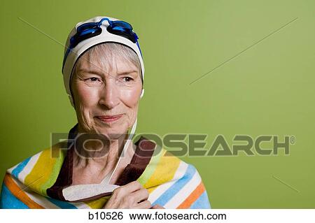 Close-up of a senior woman wearing a swimming cap and swimming goggles View Large Photo Image Stock Photograph - Close-up of a senior woman wearing a swimming cap and swimming goggles. Fotosearch