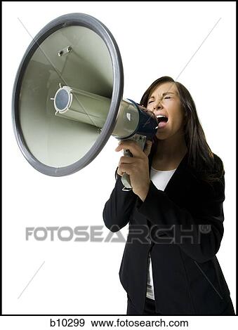 Close-up of a teenage girl shouting into a megaphone View Large Photo Image Stock Photo - Close-up of a teenage girl shouting into a megaphone. Fotosearch