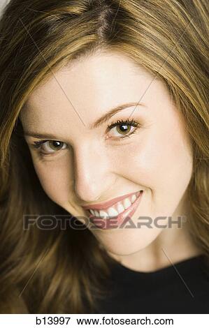 Stock Photo - Close-up of a woman smiling. Fotosearch