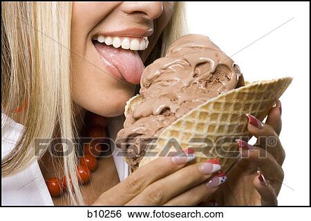 Close-up of a young woman licking an ice-cream cone View Large Photo Image Stock Photograph - Close-up of a young woman licking an ice-cream cone. Fotosearch
