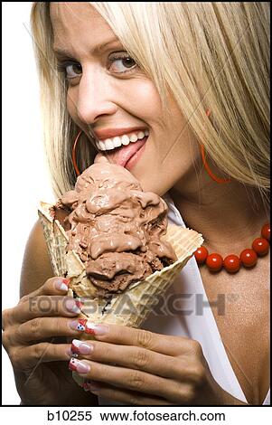 Close-up of a young woman licking an ice-cream cone View Large Photo Image Stock Photography - Close-up of a young woman licking an ice-cream cone. Fotosearch