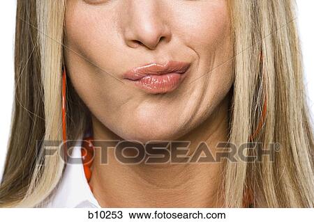 Close-up of a young woman making a face View Large Photo Image Stock Image - Close-up of a young woman making a face. Fotosearch