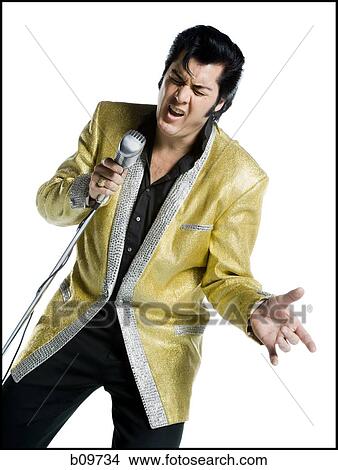 Close-up of an Elvis impersonator singing into a microphone View Large Photo Image Picture - Close-up of an Elvis impersonator singing into a microphone. Fotosearch