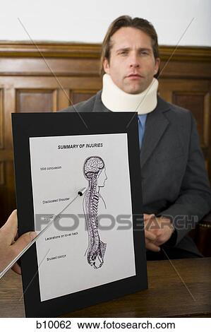Stock Image - Close-up of an exhibit of evidence in front of a victim in a courtroom. Fotosearch