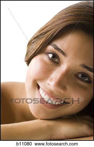 Stock Image - Close-up of beaul young woman's face. Fotosearch