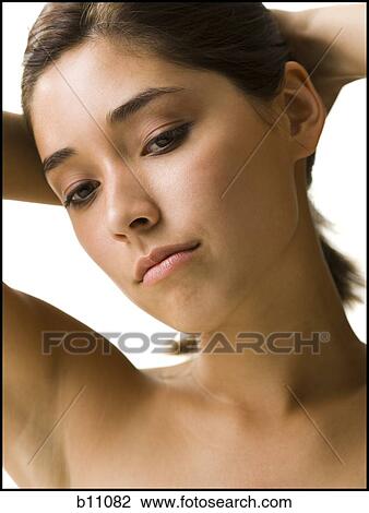 Stock Image - Close-up of beaul young woman's face. Fotosearch