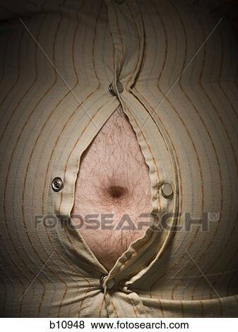 Stock Photo - Close-up of fat stomach bursting through shirt. Fotosearch