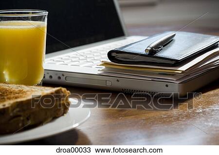 Close-up of laptop daytimer and papers on desk View Large Photo Image Stock Image - Close-up of laptop daytimer and papers on desk. Fotosearch