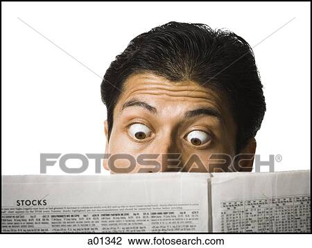 Stock Image - Close-up of man reading newspaper. Fotosearch