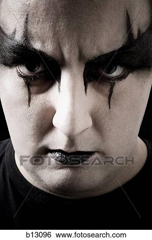 Close-up of man with black and white makeup View Large Photo Image Stock Photograph - Close-up of man with black and white makeup. Fotosearch