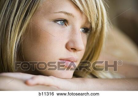Stock Photograph - Close-up of smiling young woman. Fotosearch