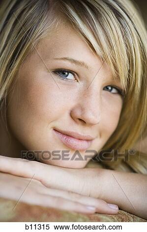 Close-up of smiling young woman View Large Photo Image Stock Photography - Close-up of smiling young woman. Fotosearch