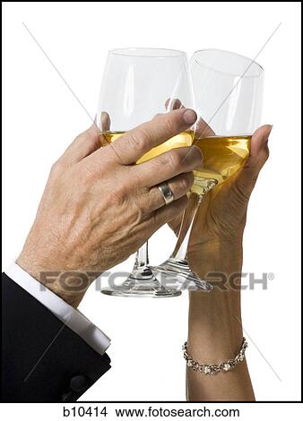 Picture - Close-up of two people toasting glasses of wine. Fotosearch