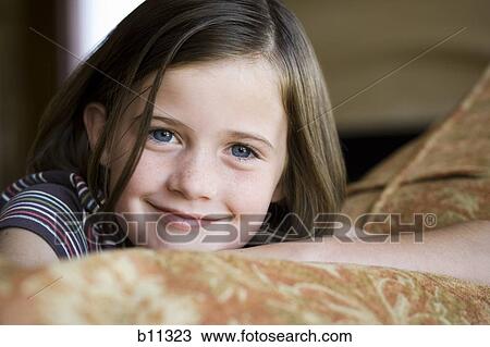 Close-up of young girl's smiling face View Large Photo Image Stock Image - Close-up of young girl's smiling face. Fotosearch