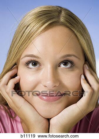 Close-up of young woman's face View Large Photo Image Stock Photo - Close-up of young woman's face. Fotosearch