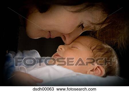 Stock Image - Closeup of mother with sleeping baby. Fotosearch